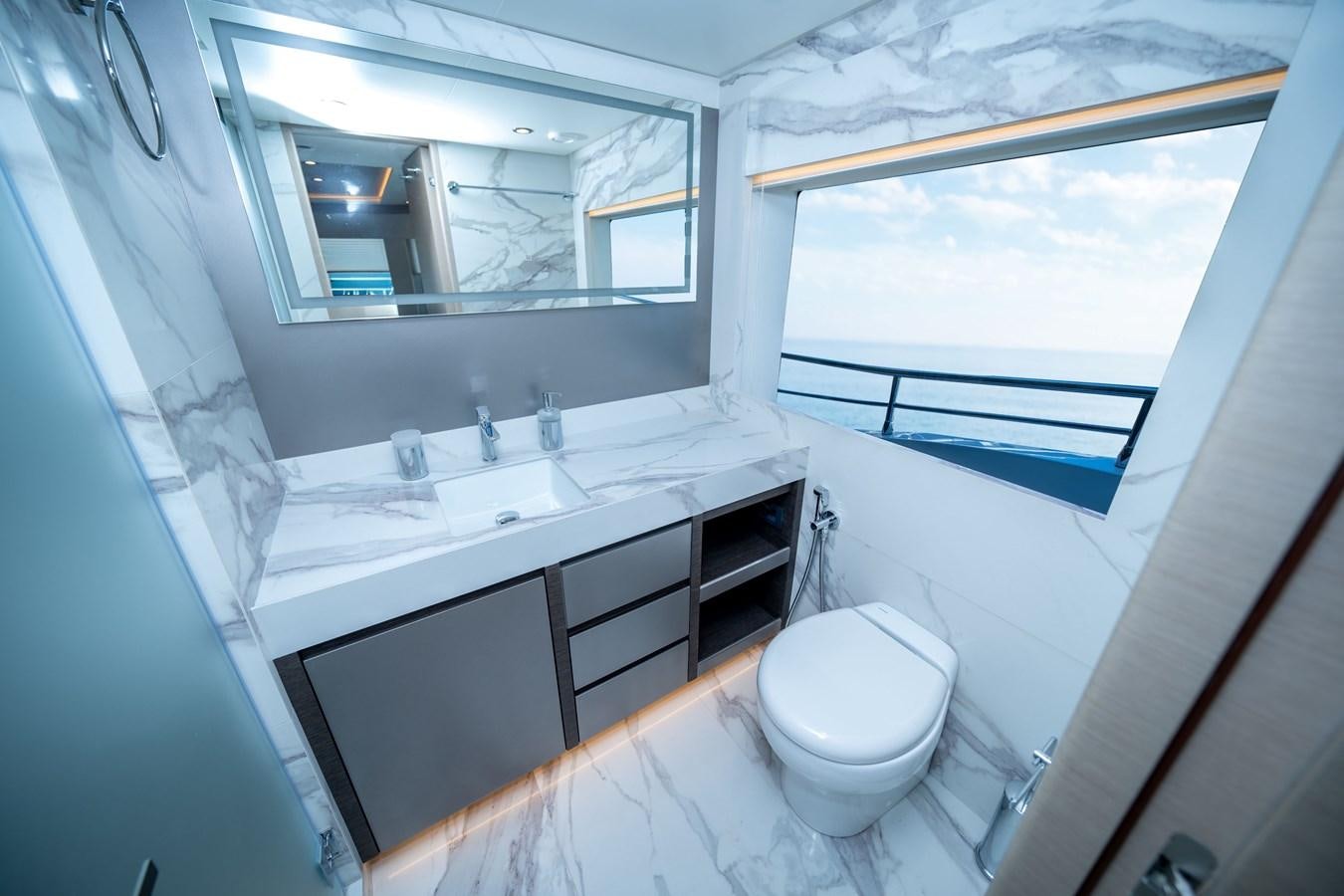 a bathroom with a sink and a toilet aboard #4 NOMAD 75 SUV Yacht for Sale