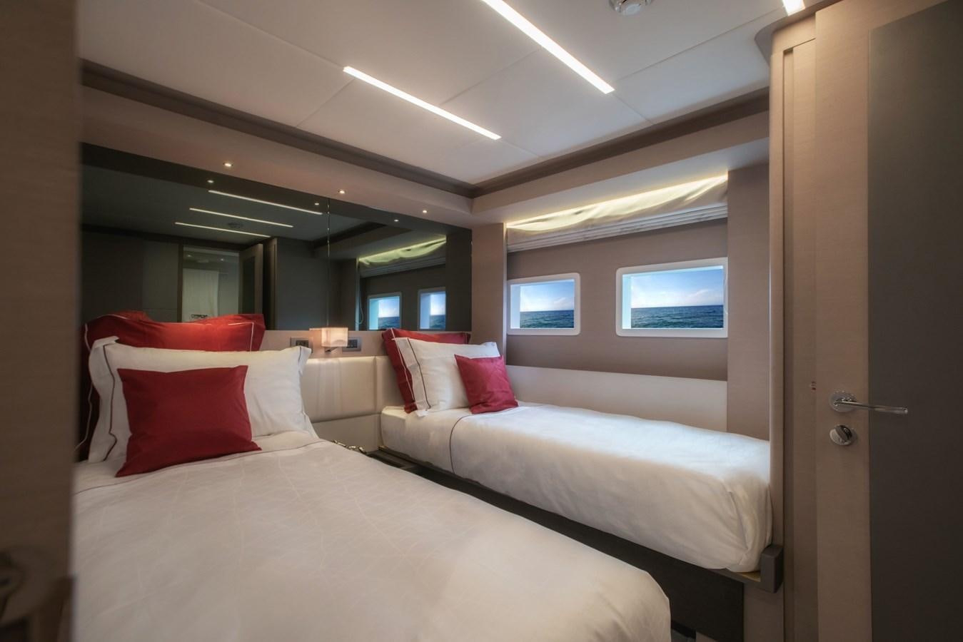 a room with two beds aboard #4 NOMAD 75 SUV Yacht for Sale
