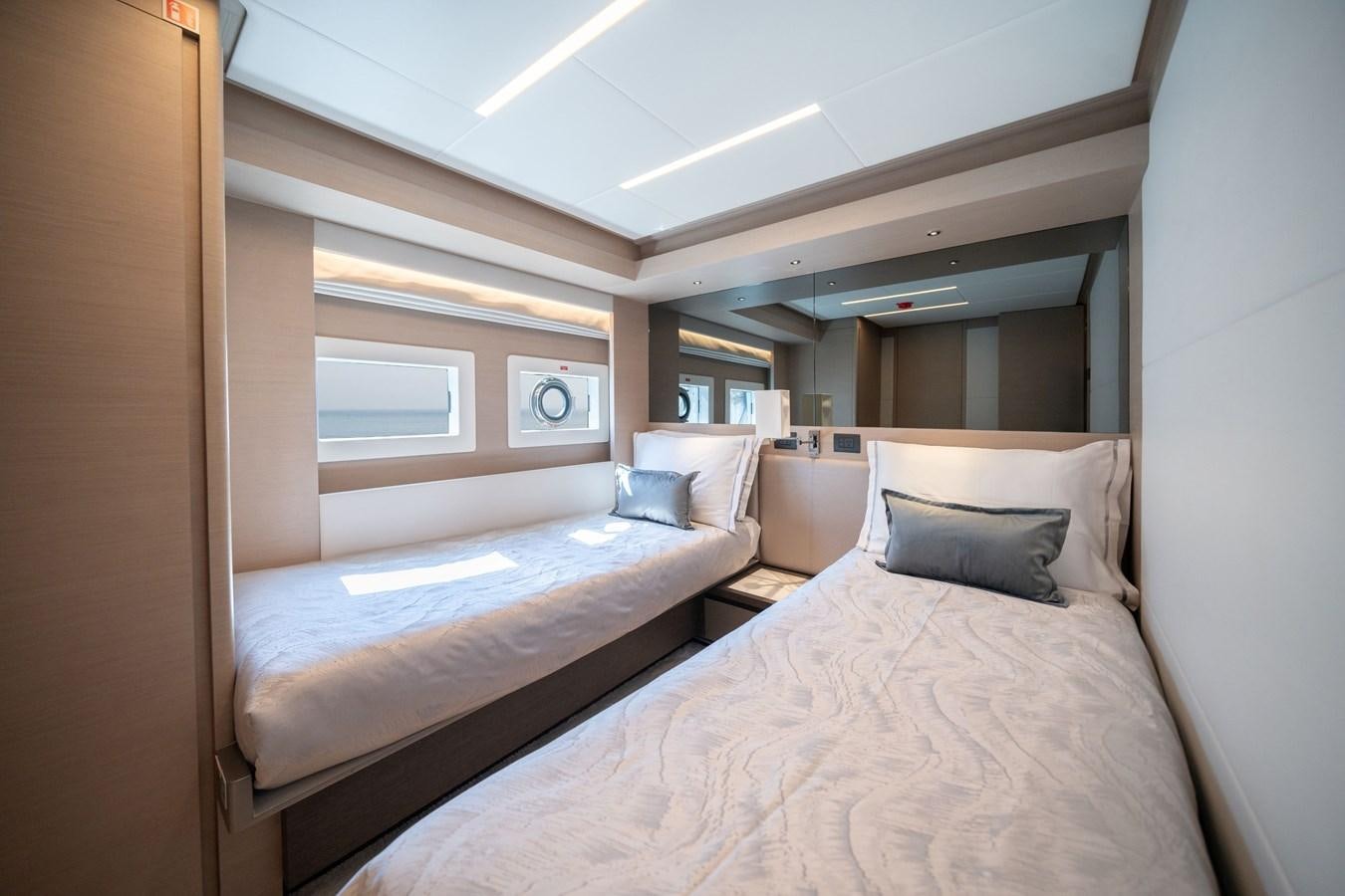 a room with two beds aboard #4 NOMAD 75 SUV Yacht for Sale