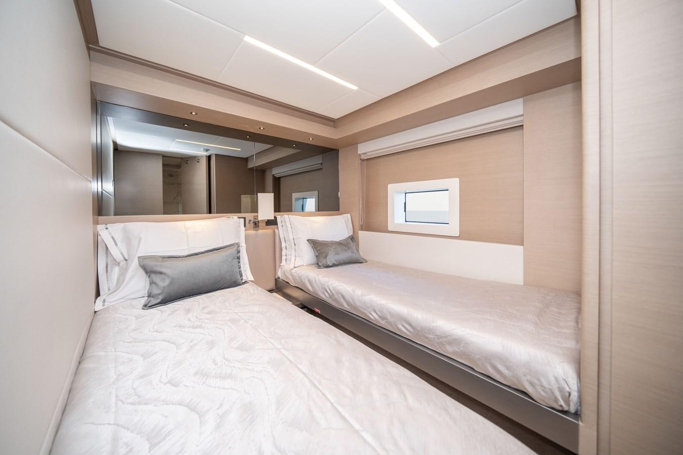 a room with two beds aboard #4 NOMAD 75 SUV Yacht for Sale