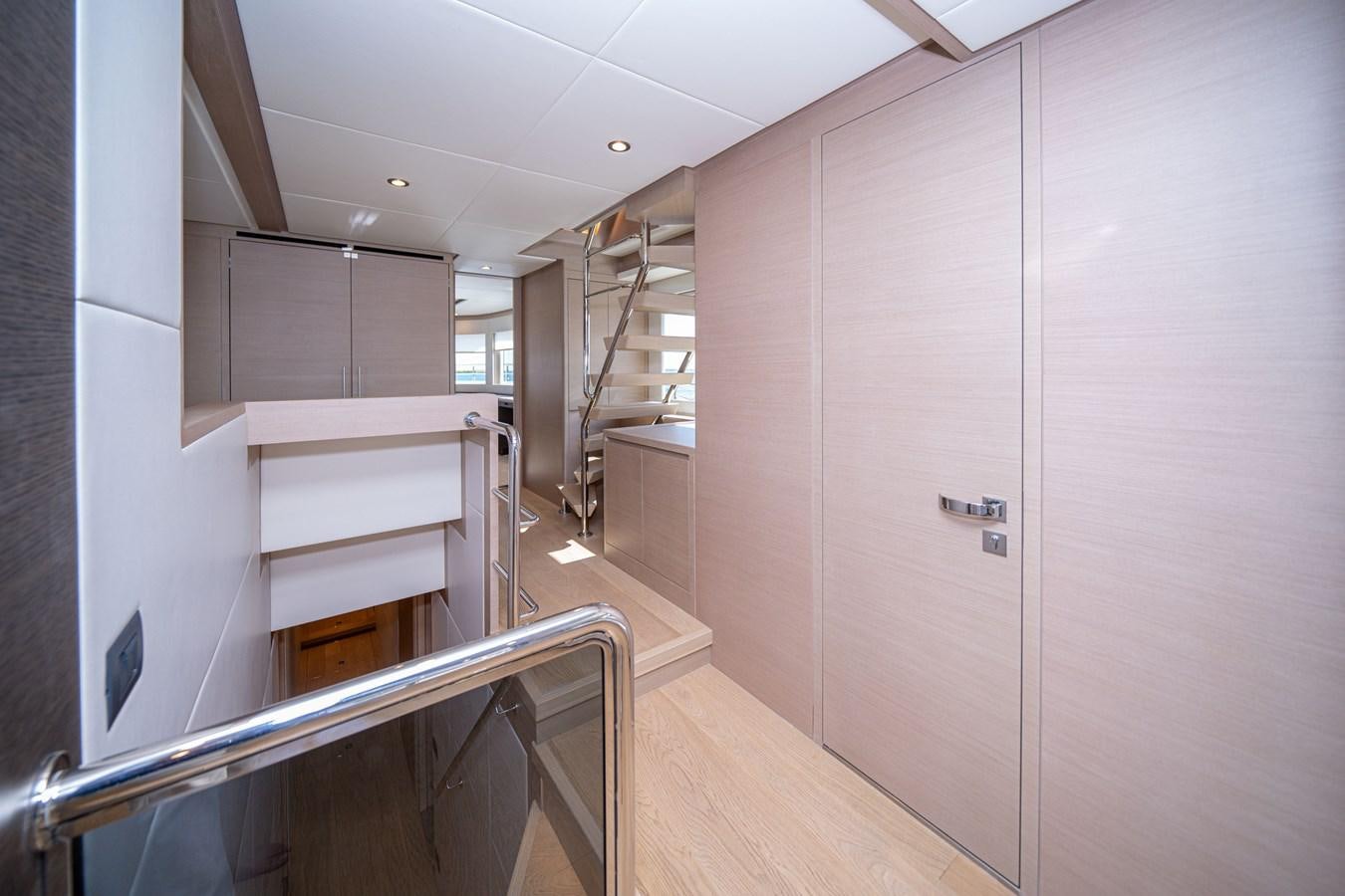 a room with a staircase and a staircase aboard #4 NOMAD 75 SUV Yacht for Sale