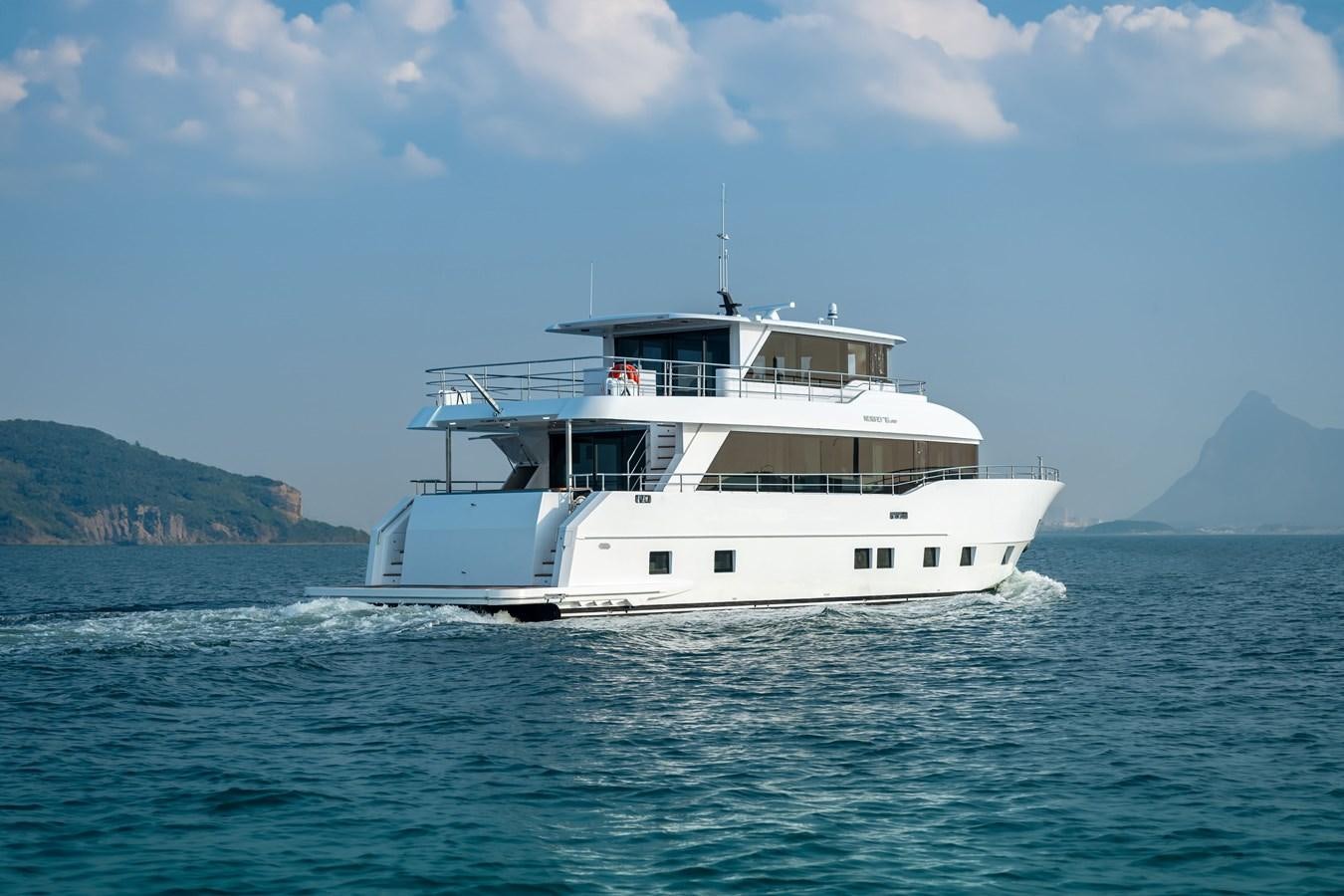 a white boat on the water aboard #4 NOMAD 75 SUV Yacht for Sale