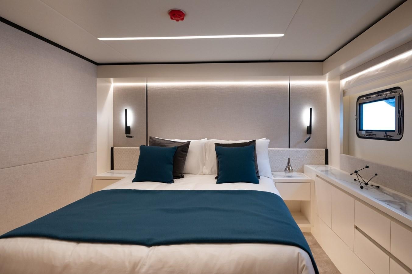 a bed in a room aboard NOMAD 70 SUV Yacht for Sale