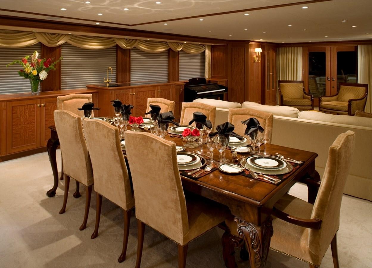 a dining room with a table set aboard ARETI I Yacht for Sale