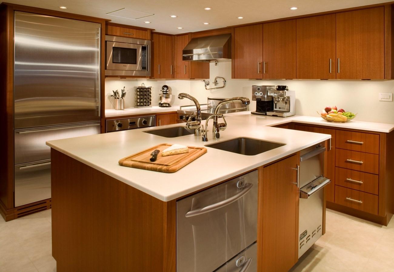 a kitchen with a stove and oven aboard ARETI I Yacht for Sale