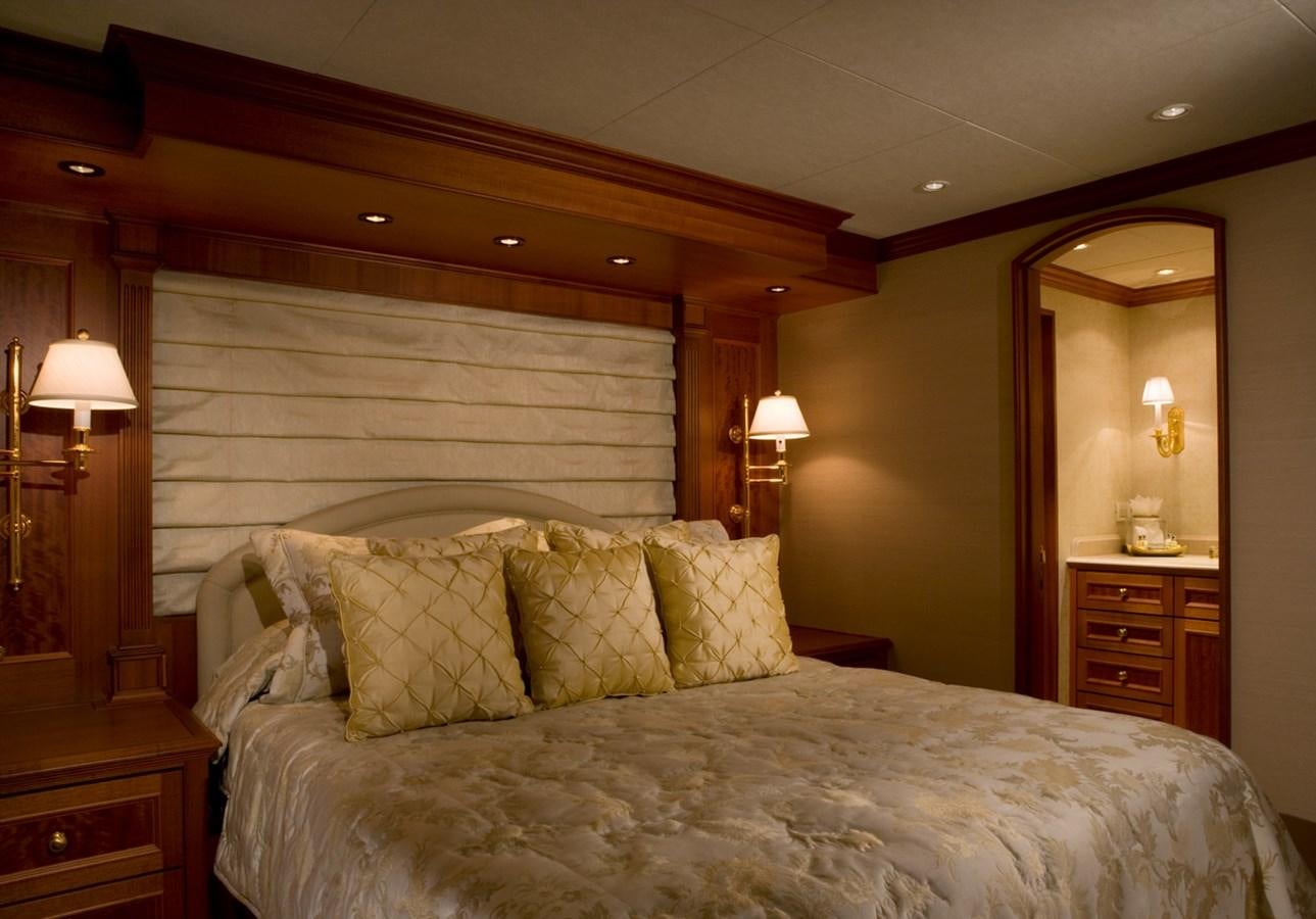 a bedroom with a large bed aboard ARETI I Yacht for Sale