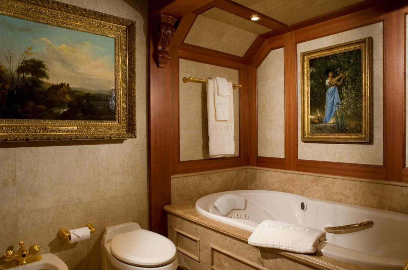 a bathroom with a painting on the wall aboard ARETI I Yacht for Sale