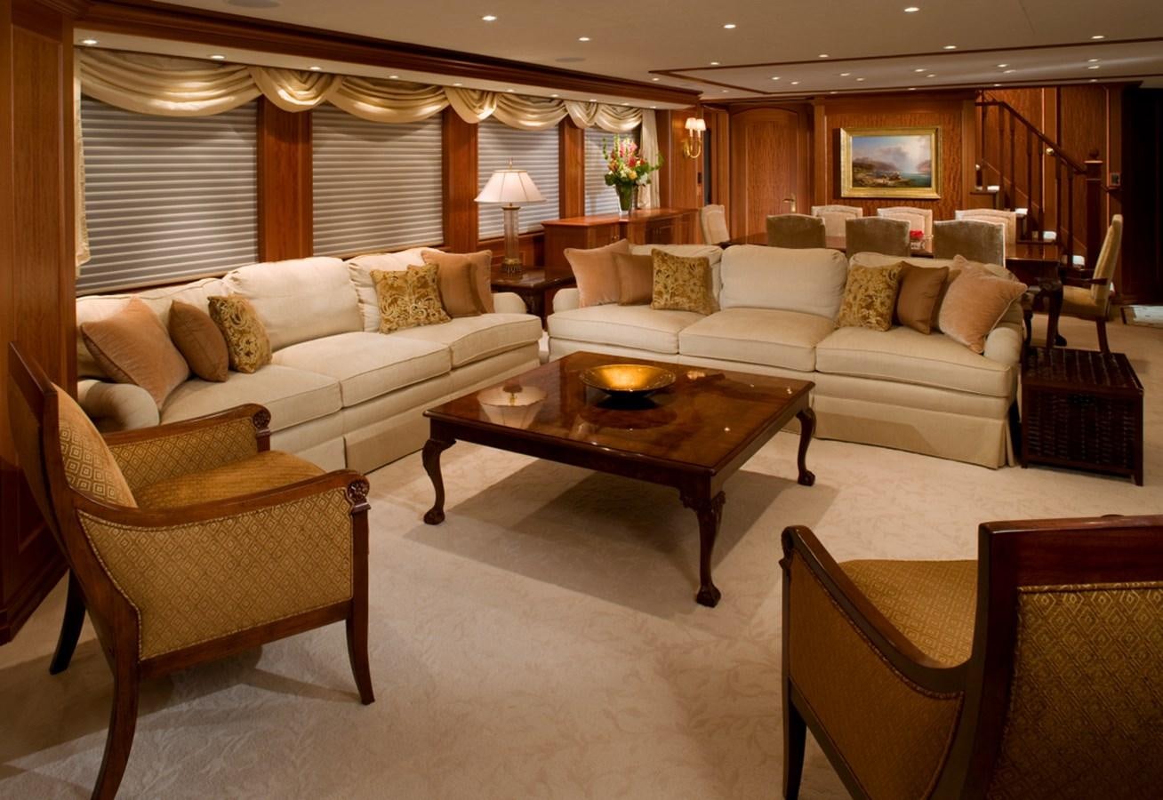 a living room with a couch and a coffee table aboard ARETI I Yacht for Sale