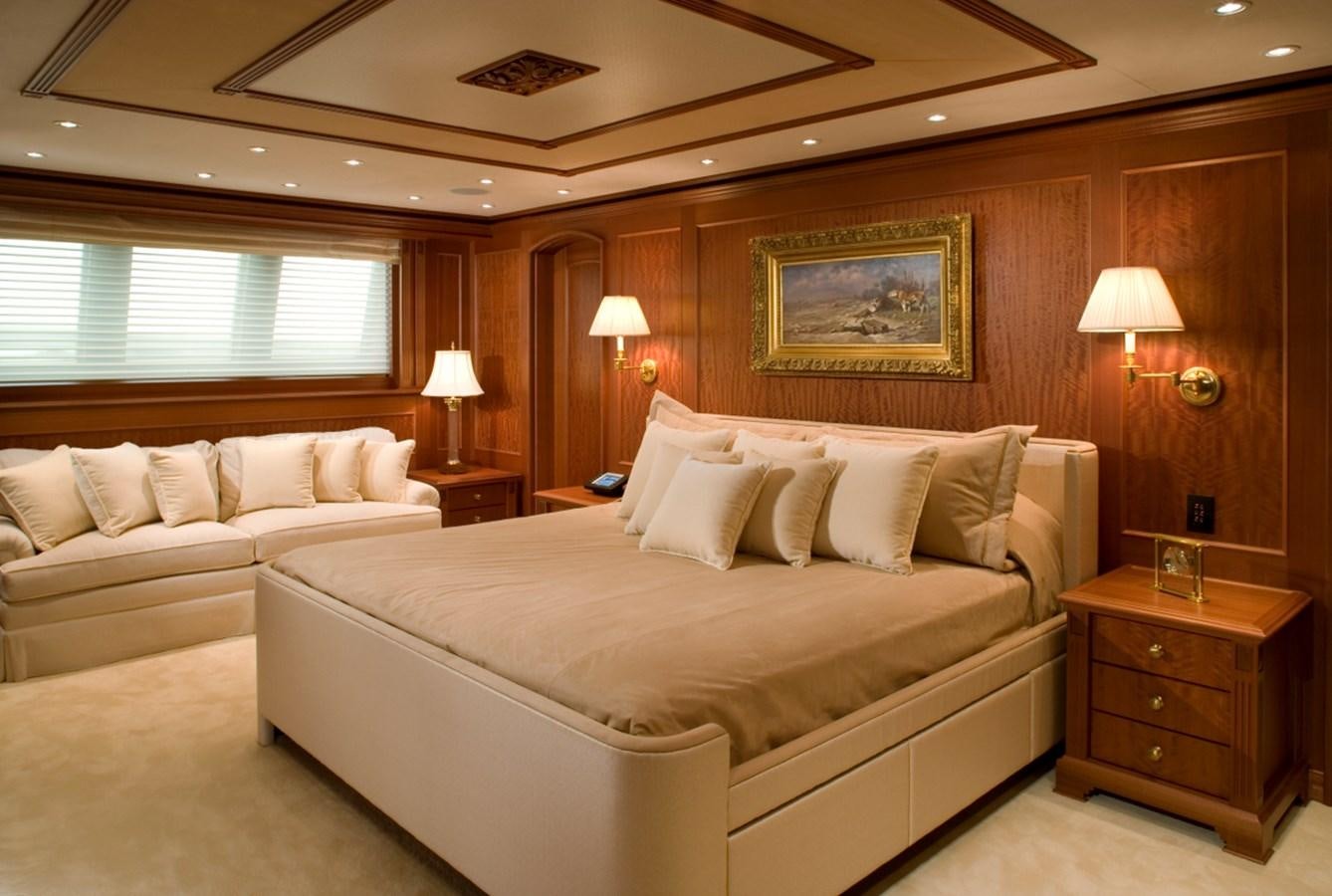 a hotel room with a bed and a couch aboard ARETI I Yacht for Sale