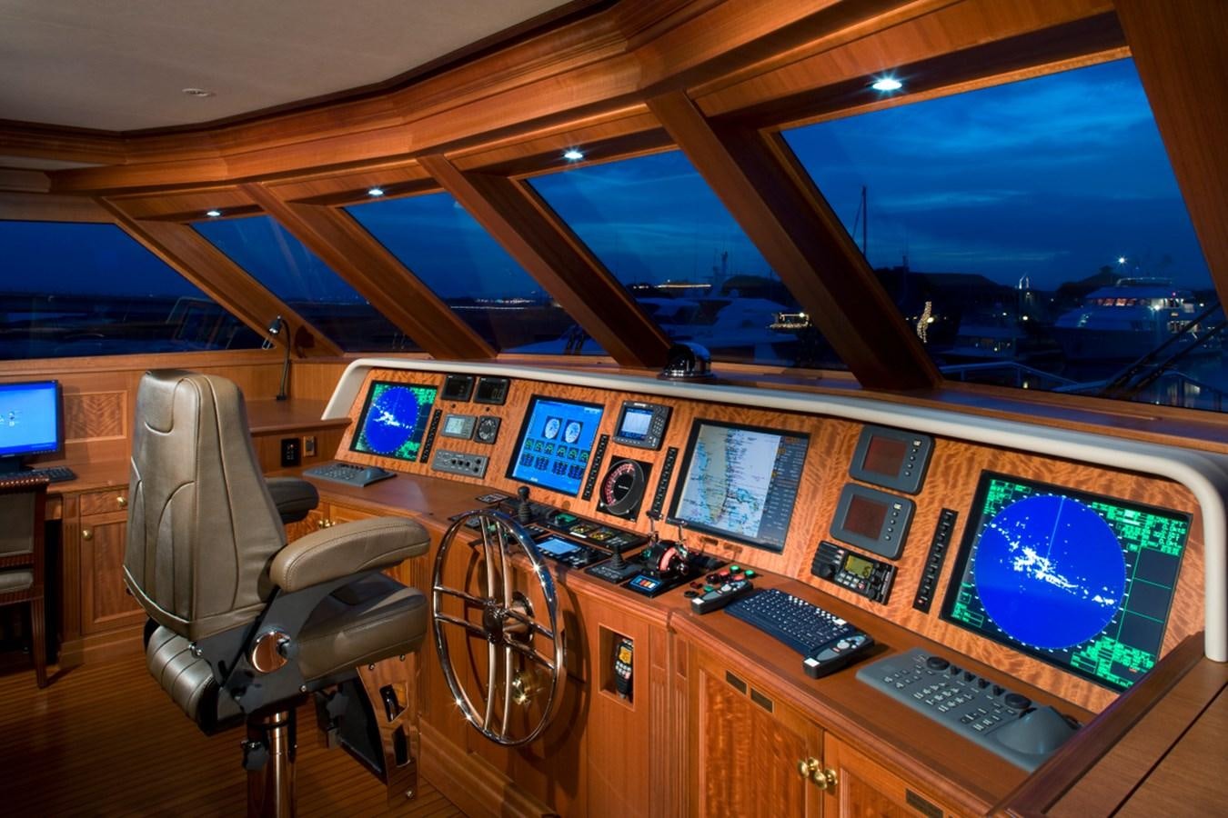 a room with a desk and chairs aboard ARETI I Yacht for Sale