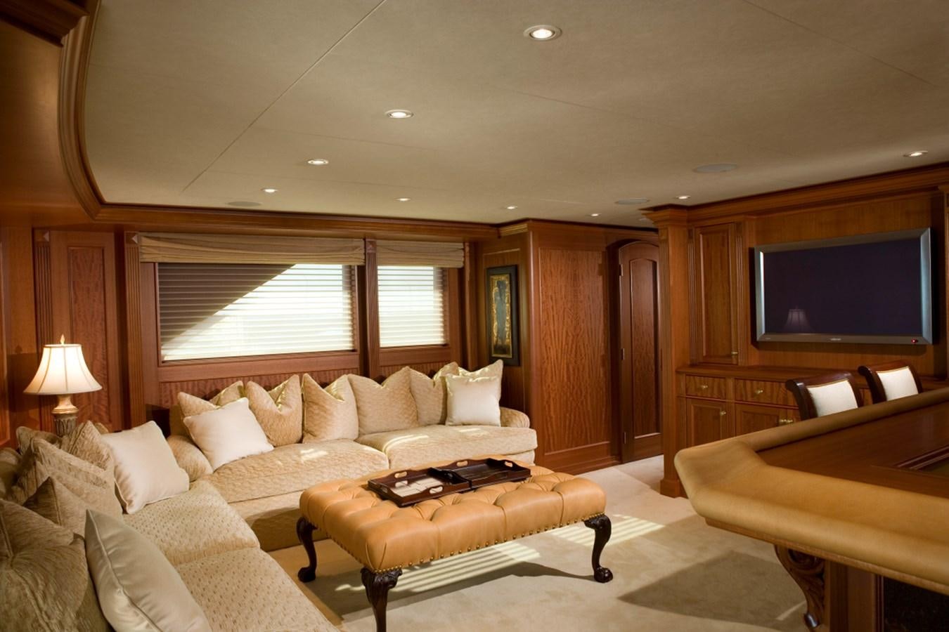 a living room with a couch and a tv aboard ARETI I Yacht for Sale
