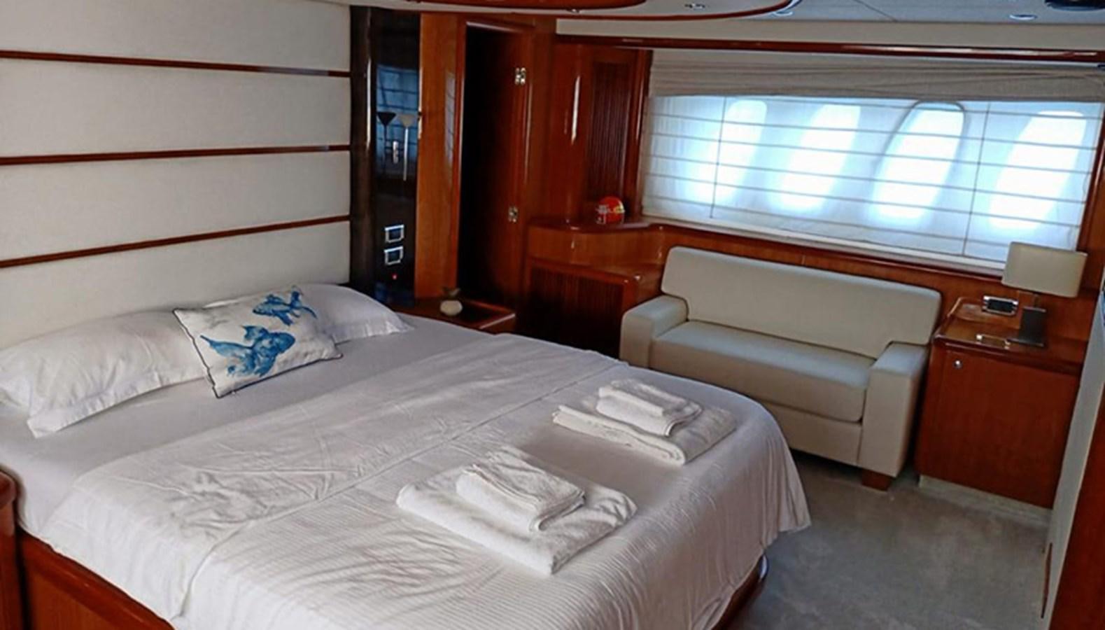a room with a bed and a couch aboard MYA Yacht for Sale