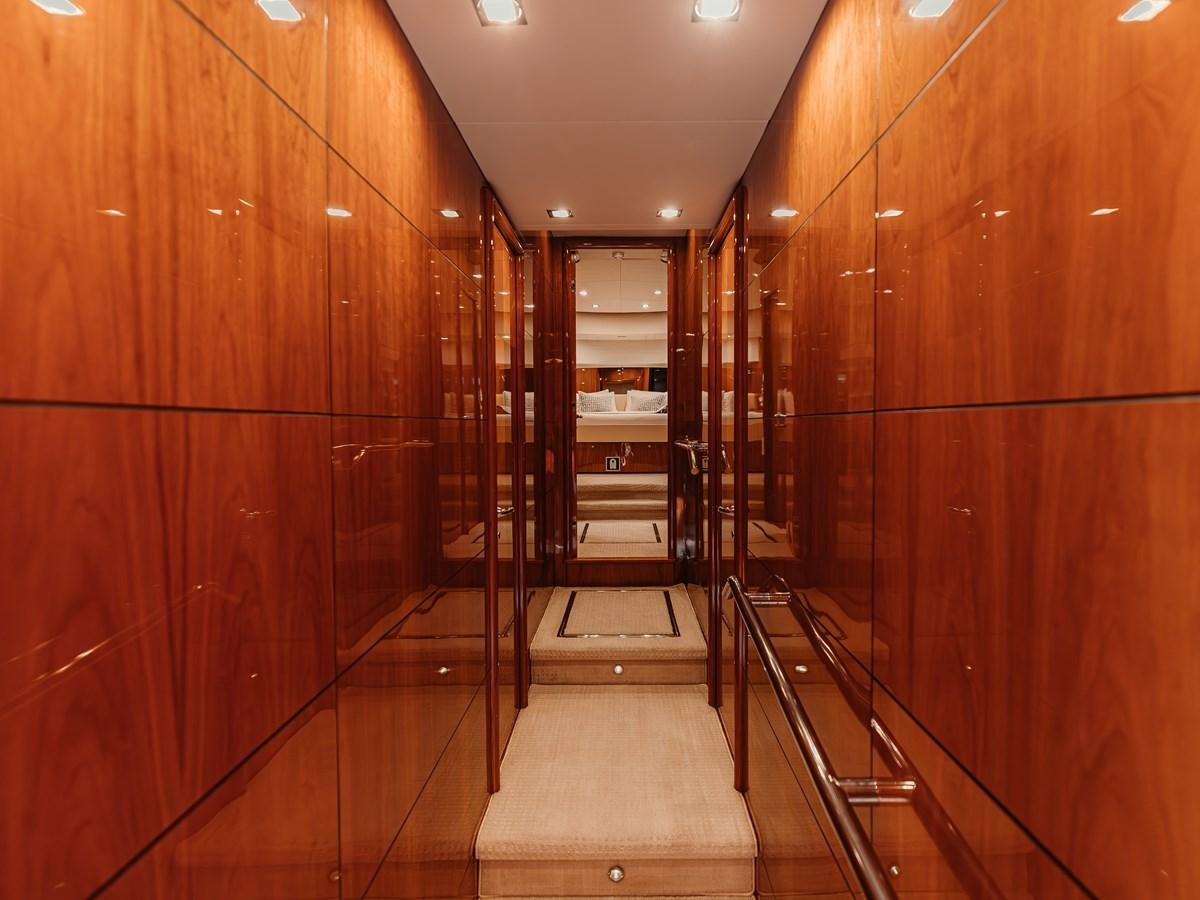 a hallway with wooden walls aboard AARNA Yacht for Sale