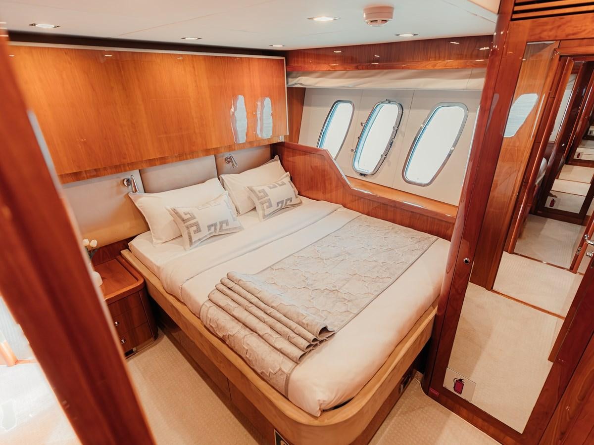 a bed in a room aboard AARNA Yacht for Sale