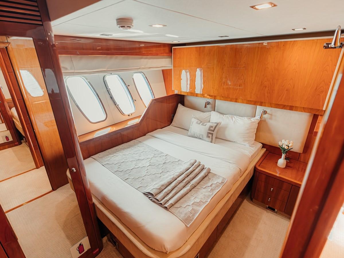 a bed in a room aboard AARNA Yacht for Sale