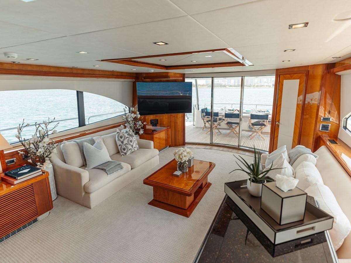 a living room with a large window aboard AARNA Yacht for Sale