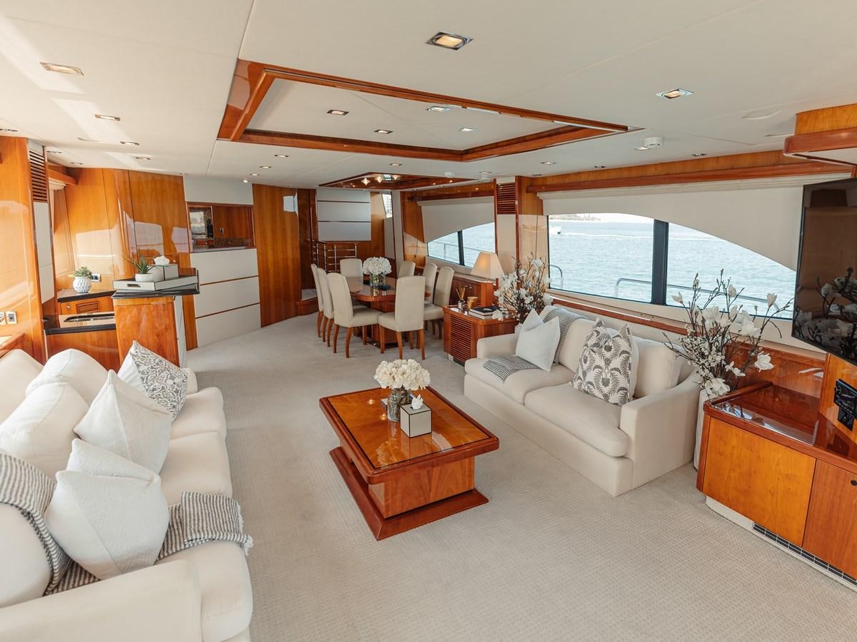 a living room with a large window aboard AARNA Yacht for Sale