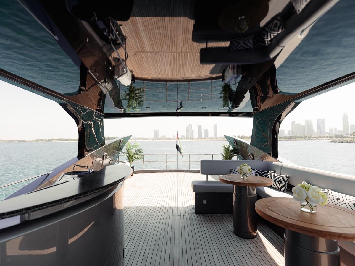 a room with a table and chairs aboard MATRIX Yacht for Sale
