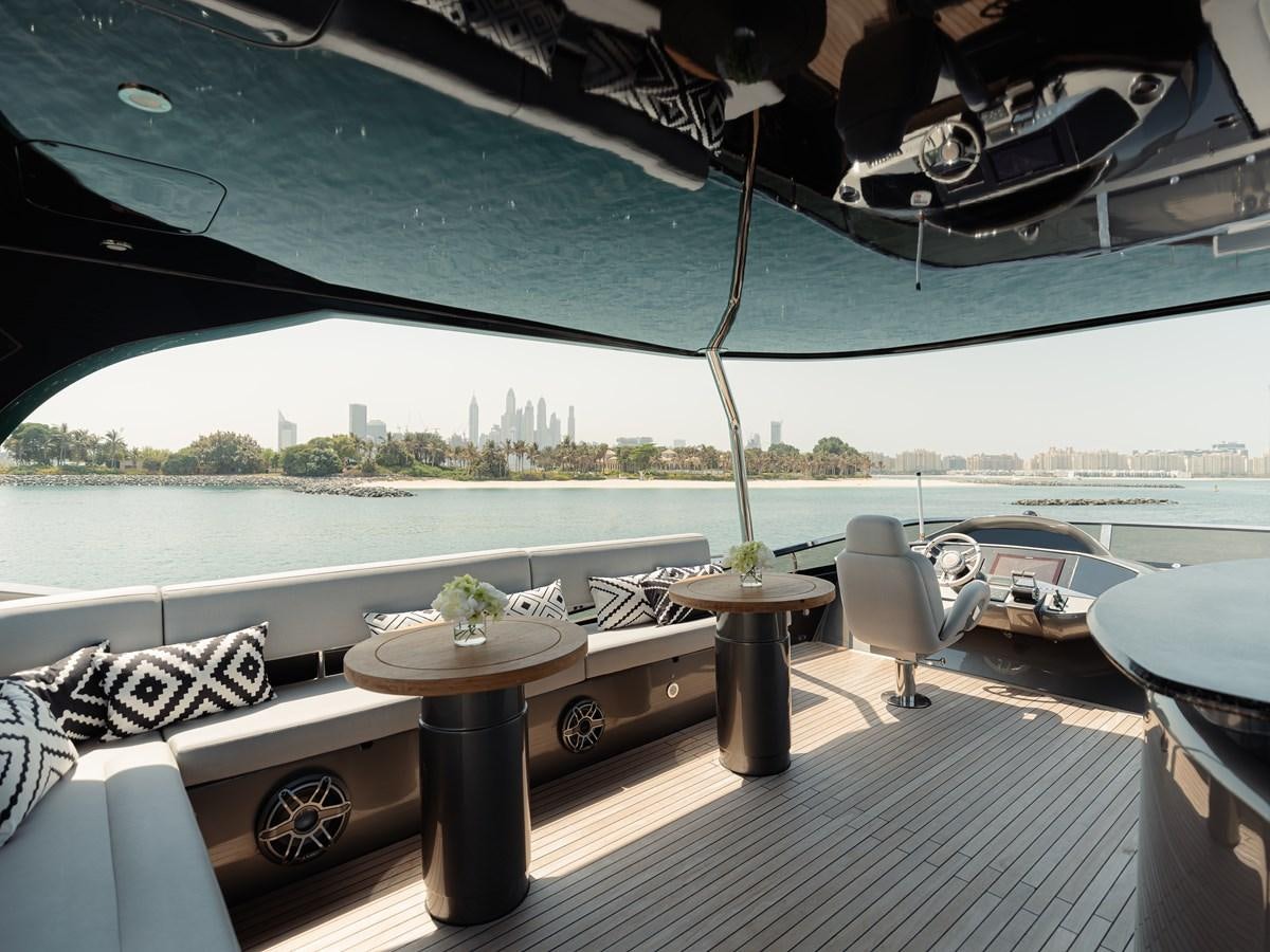 a room with a table and chairs aboard MATRIX Yacht for Sale