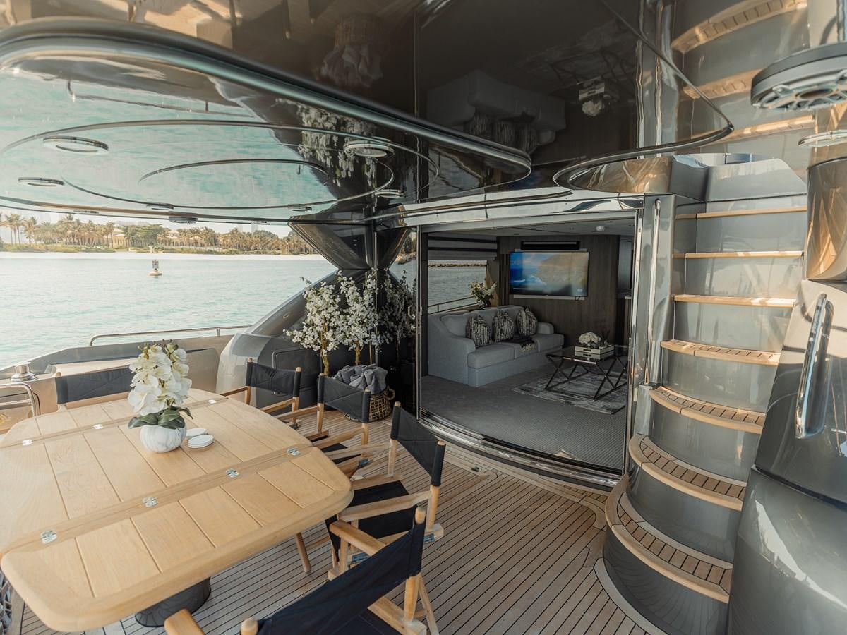 a room with a table and chairs aboard MATRIX Yacht for Sale