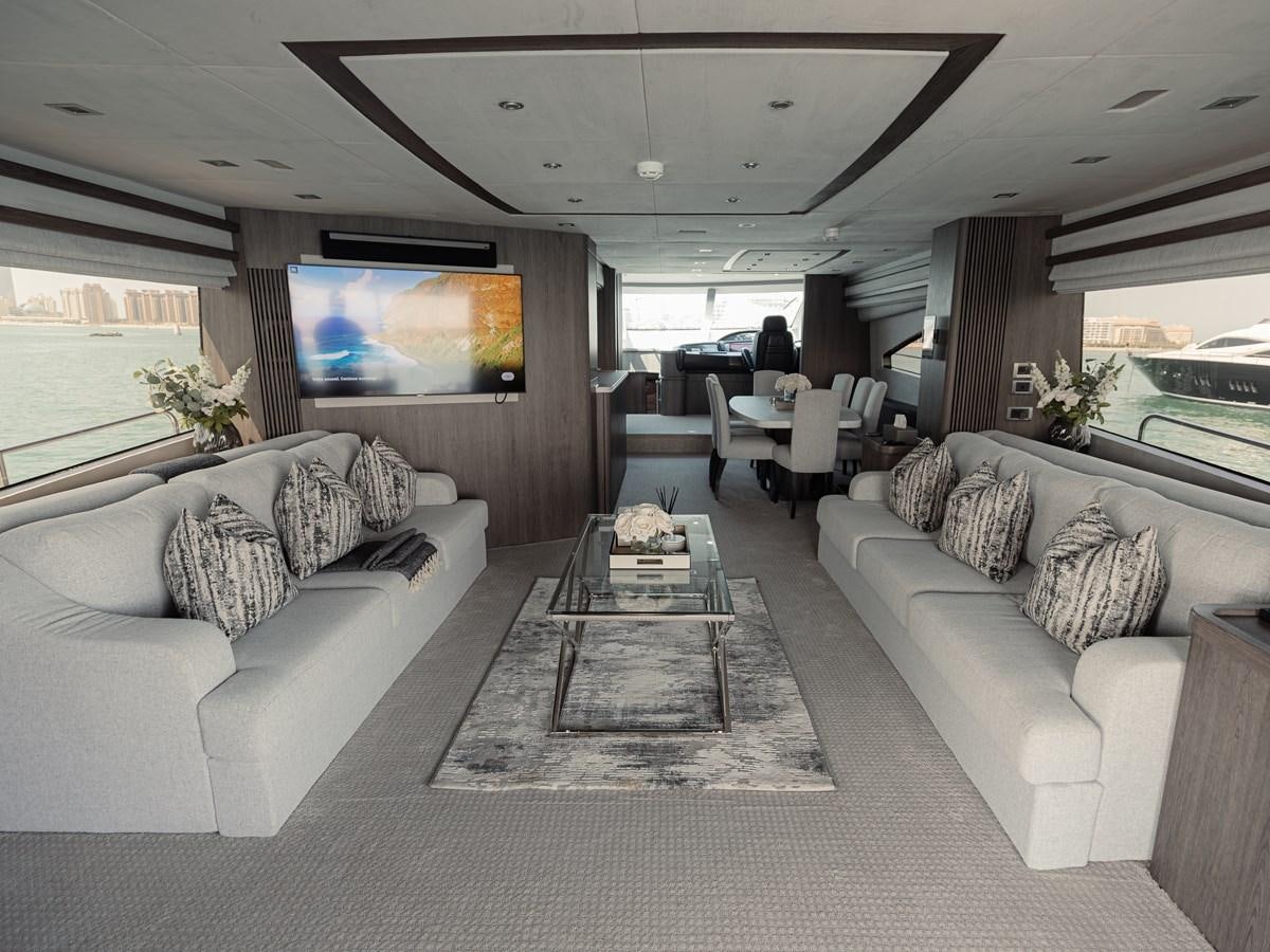 a living room with a large screen aboard MATRIX Yacht for Sale