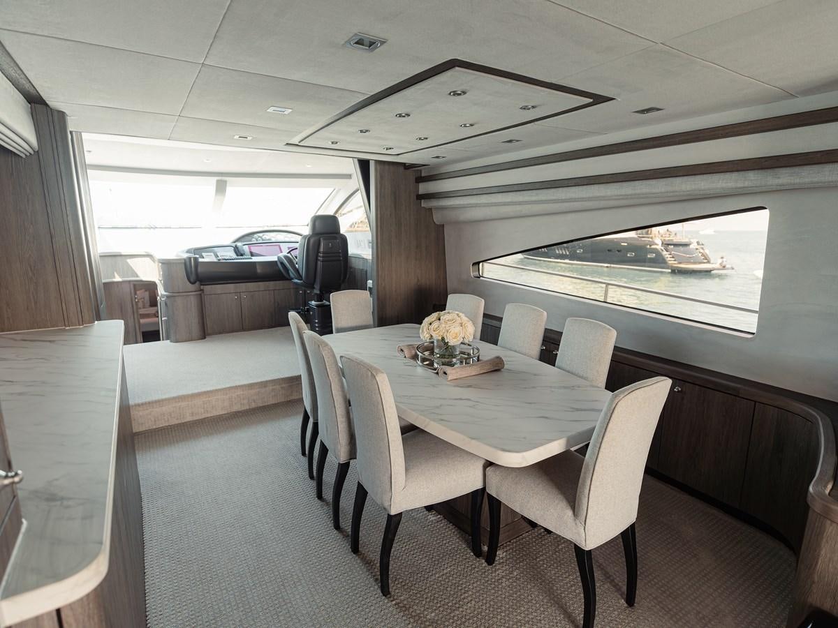 a dining table in a bus aboard MATRIX Yacht for Sale