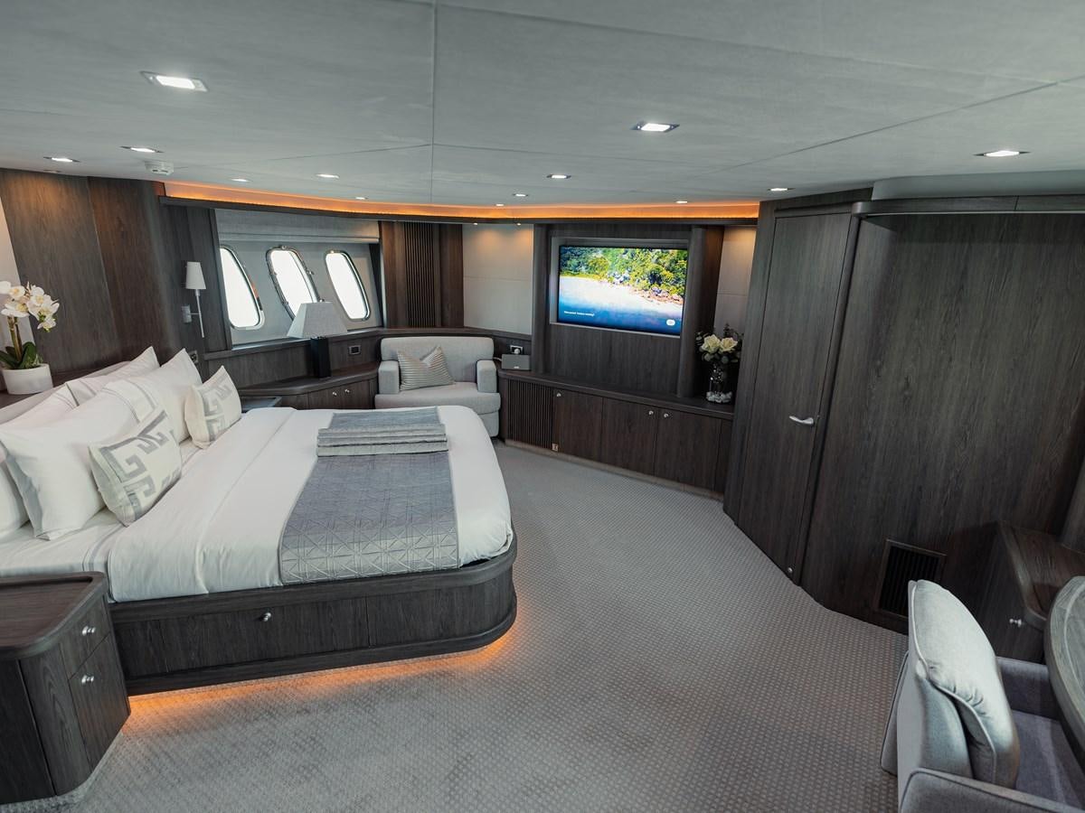 a room with a bed and a tv aboard MATRIX Yacht for Sale