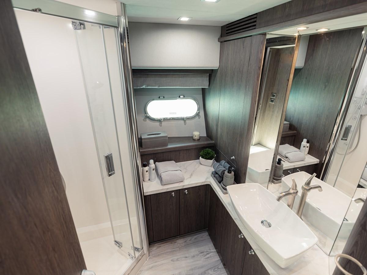 a bathroom with a large mirror aboard MATRIX Yacht for Sale