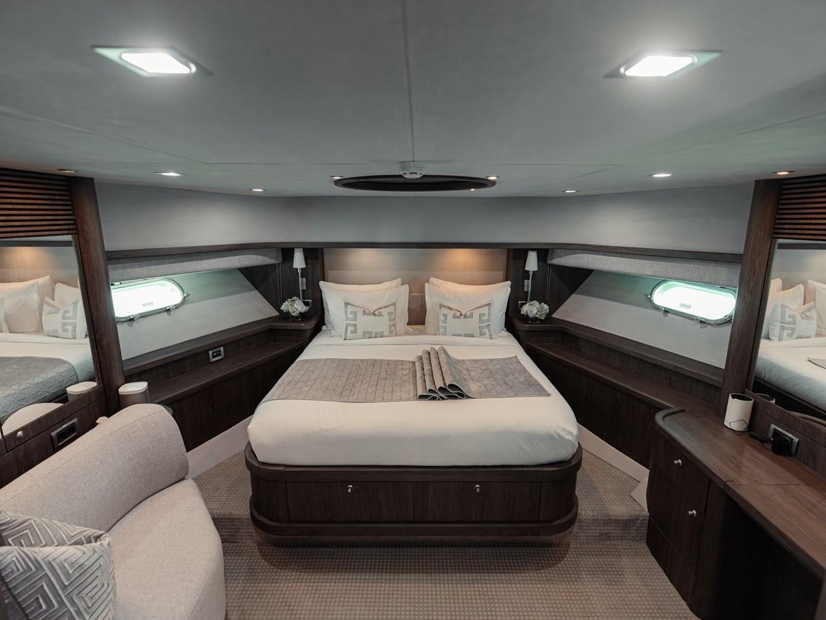 a room with a bed and a television aboard MATRIX Yacht for Sale