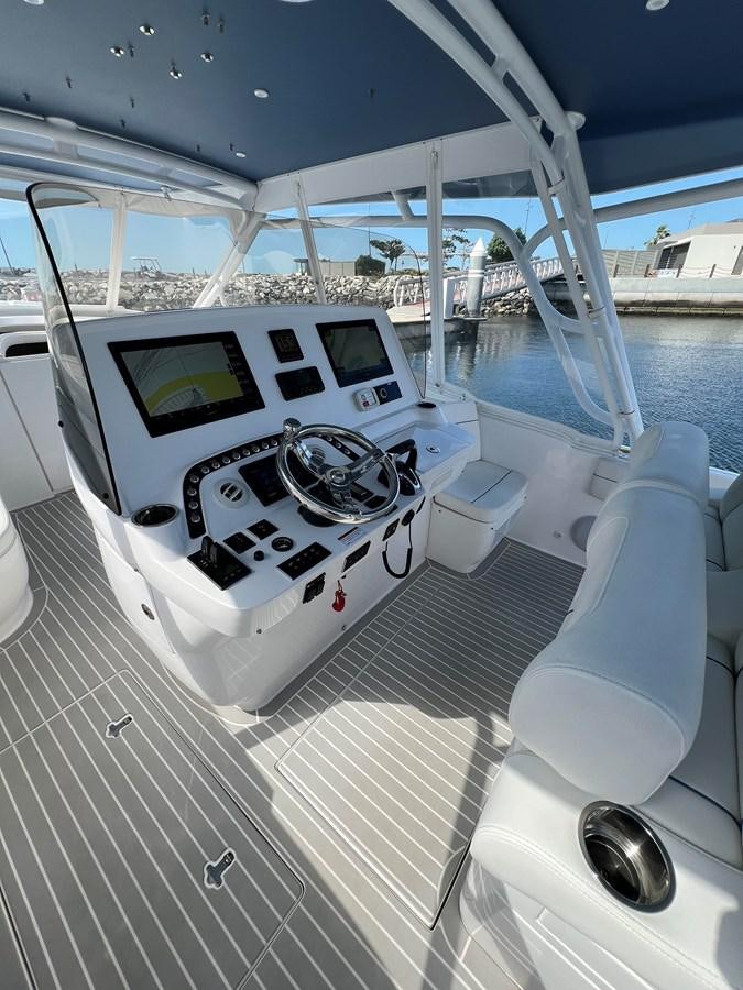 a white and black boat on a deck aboard 2023 INTREPID 41 VALOR Yacht for Sale