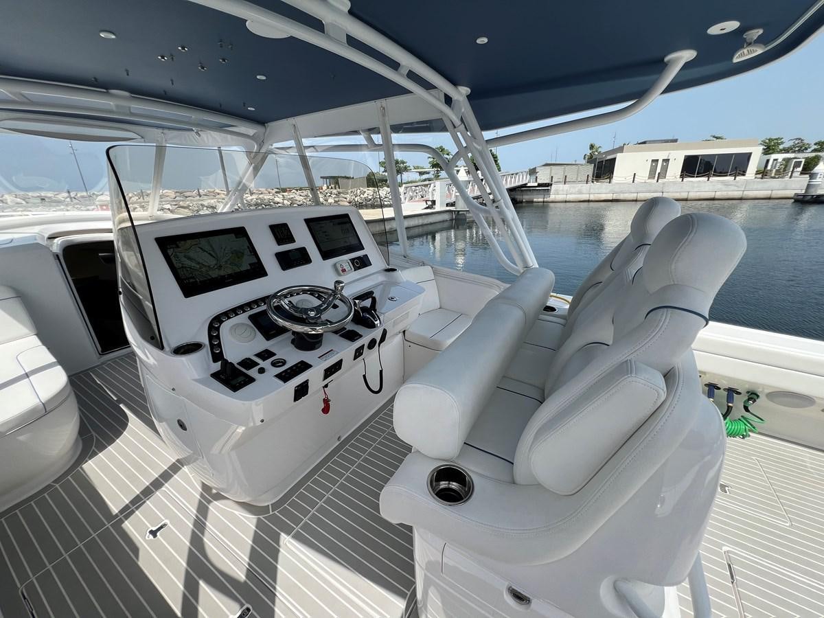 a white car with black and white stripes on it aboard 2023 INTREPID 41 VALOR Yacht for Sale