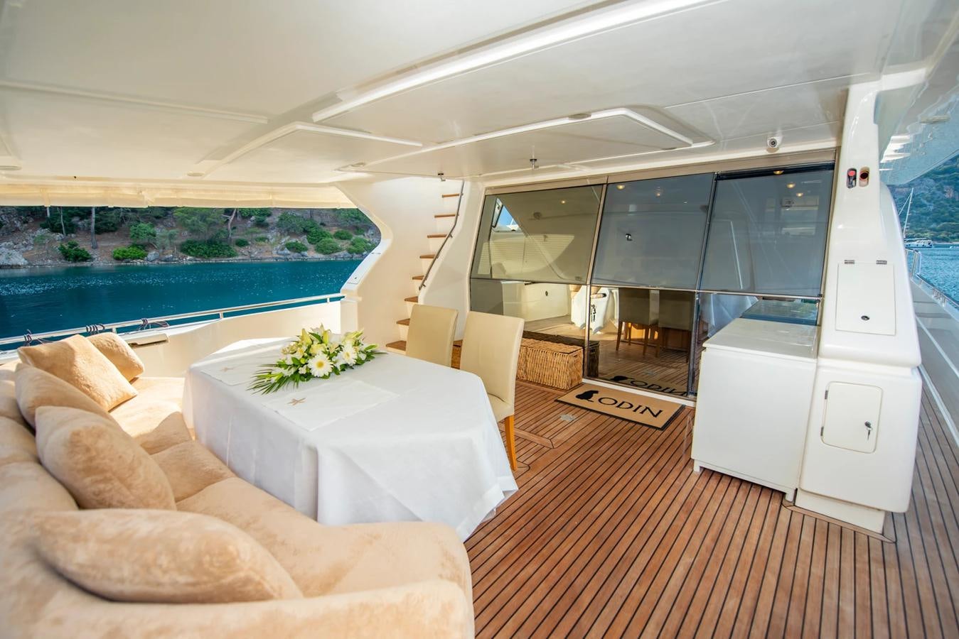 a room with a couch and a table and a pool aboard LOTUS Yacht for Sale