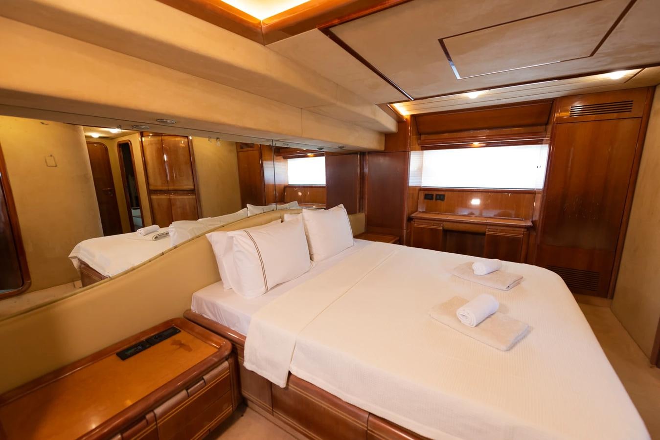 a room with a bed and a desk aboard LOTUS Yacht for Sale