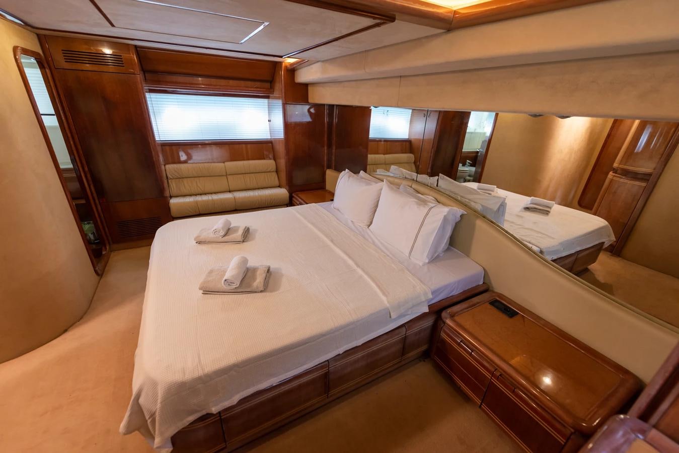 a room with beds and a window aboard LOTUS Yacht for Sale