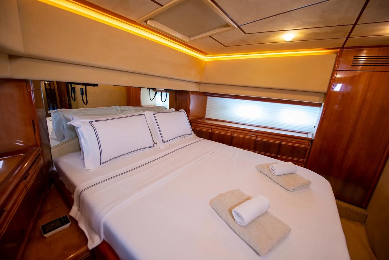 a couple of beds in a room aboard LOTUS Yacht for Sale