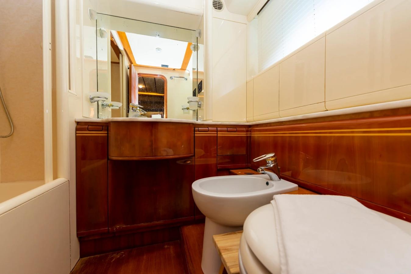 a bathroom with a sink and a bathtub aboard LOTUS Yacht for Sale