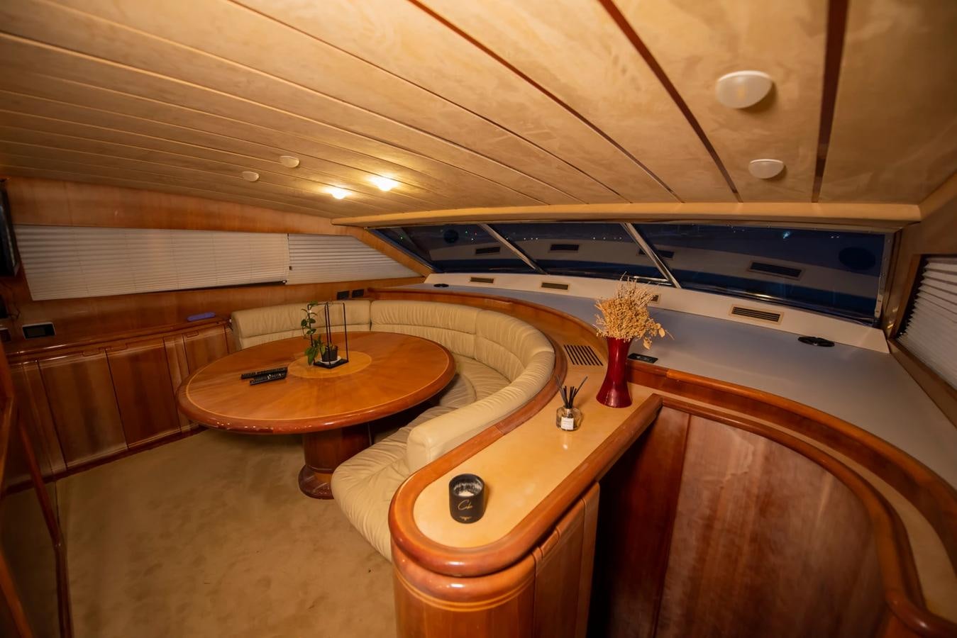 a room with a table and chairs aboard LOTUS Yacht for Sale