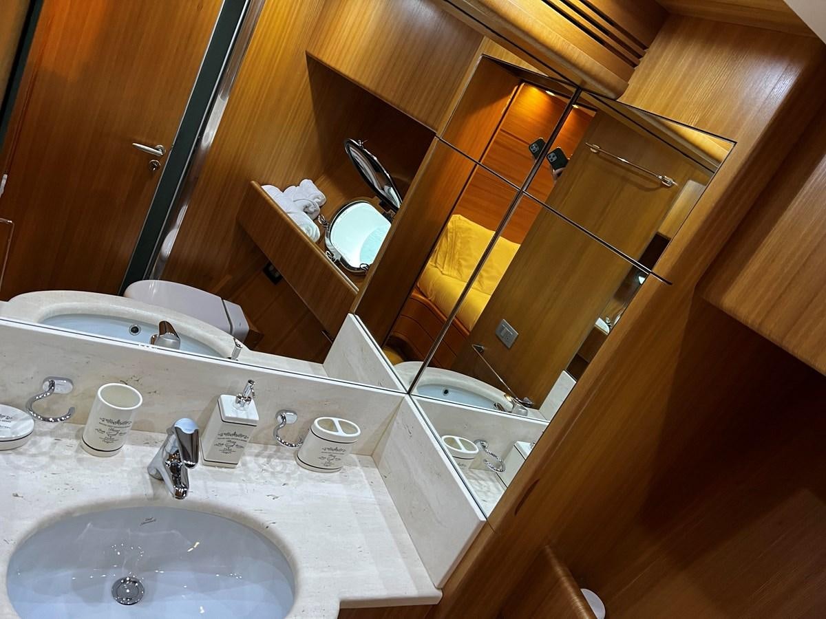 a bathroom with a large mirror aboard KOKO Yacht for Sale
