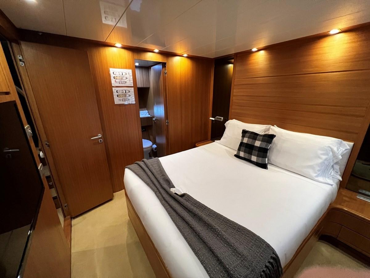 a hotel room with a bed aboard KOKO Yacht for Sale