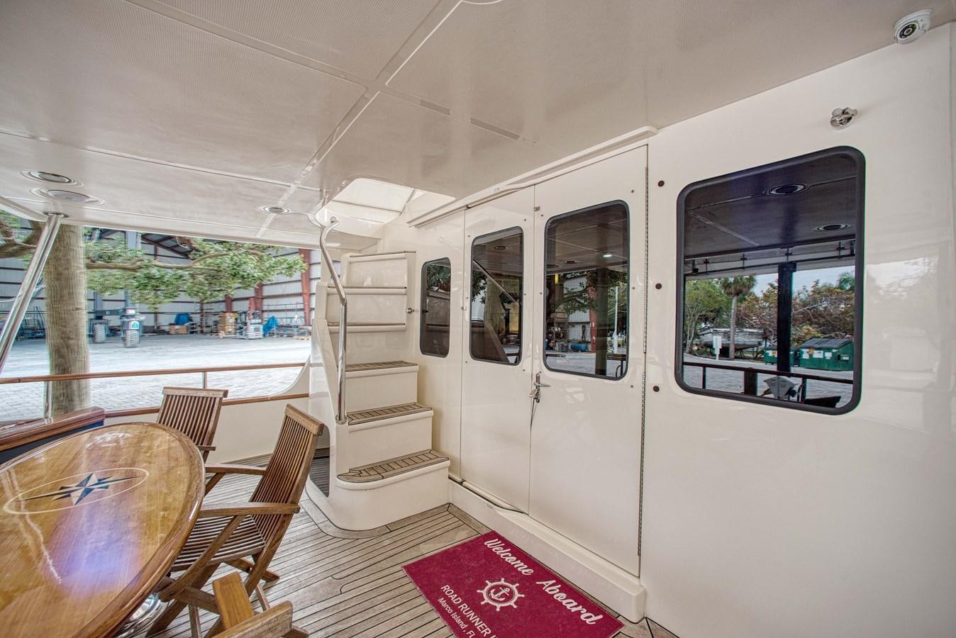 a white vehicle with a red rug aboard RODE RUNNER II Yacht for Sale
