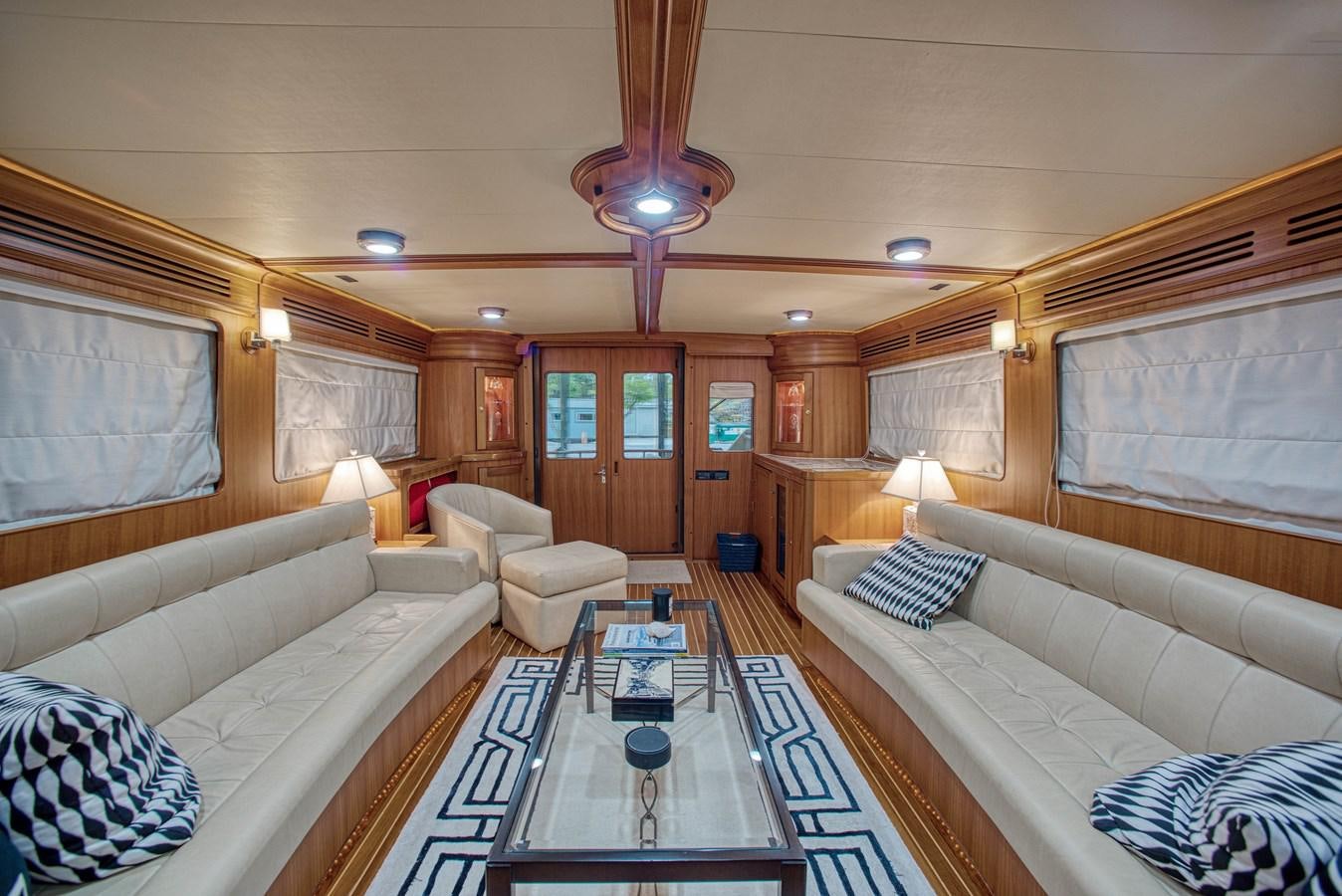 a living room with a large rug aboard RODE RUNNER II Yacht for Sale
