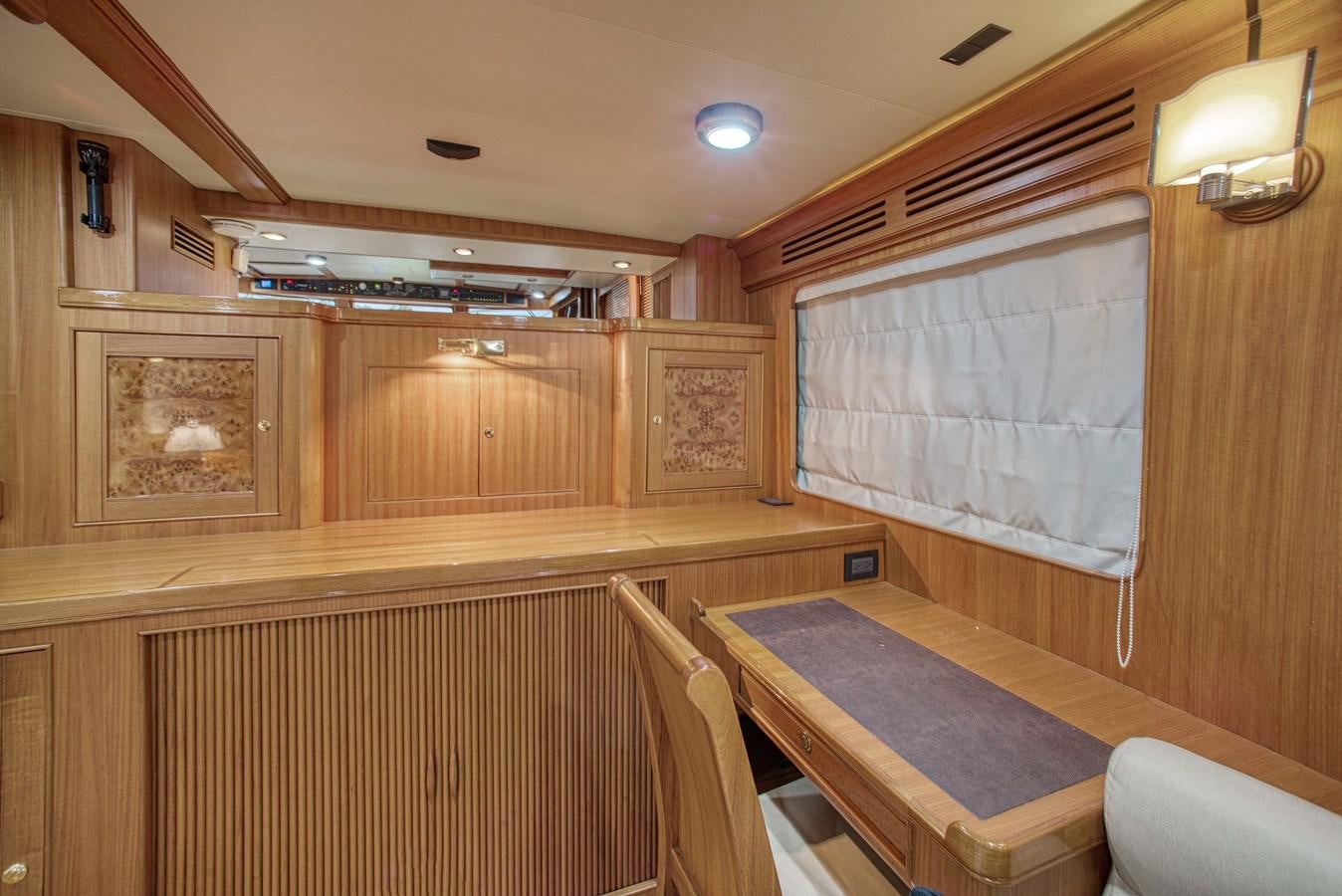 a room with a table and chairs aboard RODE RUNNER II Yacht for Sale