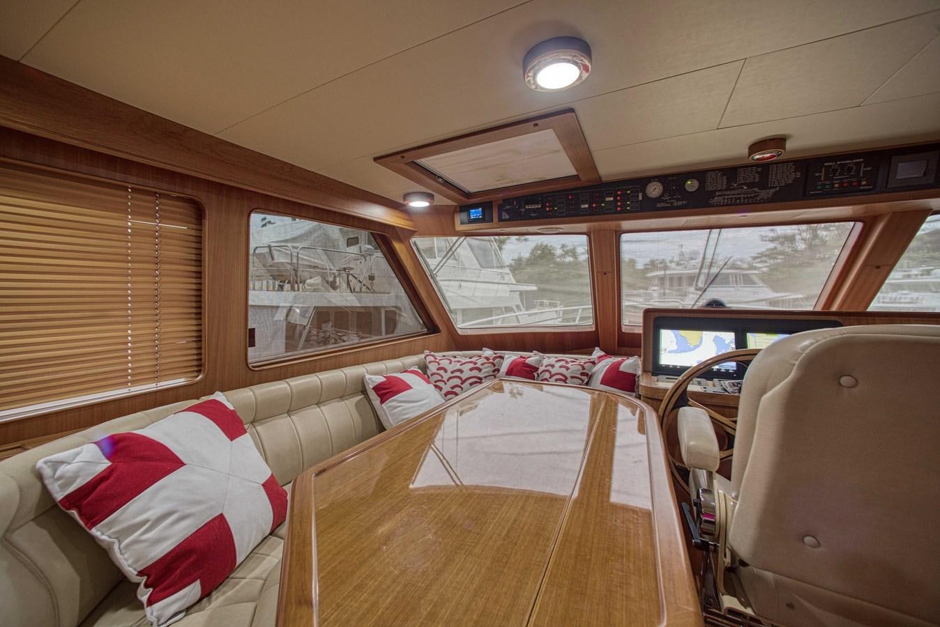 inside of a vehicle with a wood floor and a large window aboard RODE RUNNER II Yacht for Sale