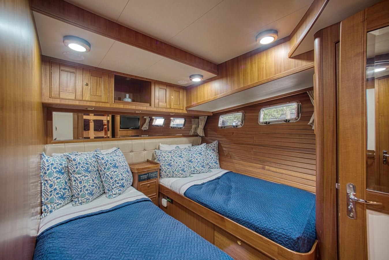 a couple of beds in a cabin aboard RODE RUNNER II Yacht for Sale