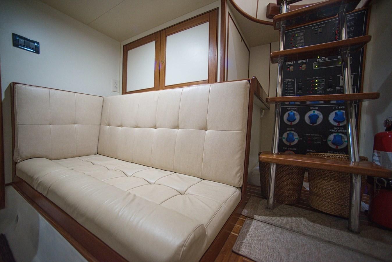 a living room with a white couch aboard RODE RUNNER II Yacht for Sale