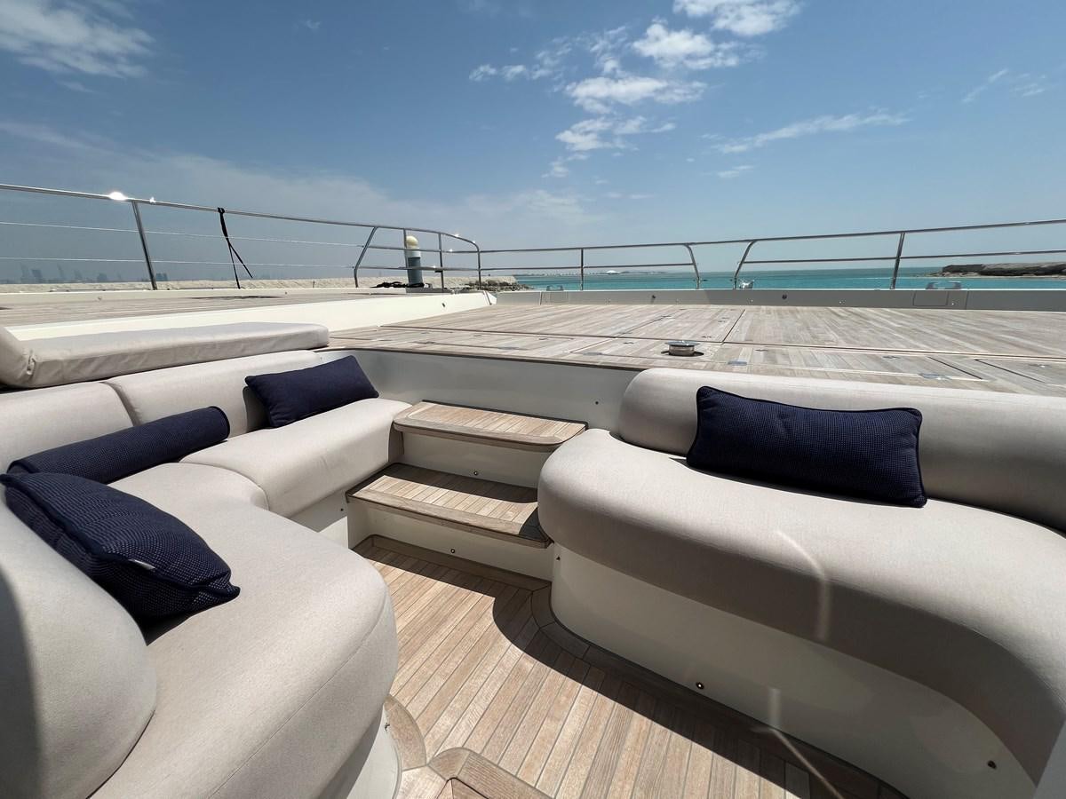 a boat deck with chairs and a railing on a sunny day aboard 2023 LAGOON 67 Yacht for Sale
