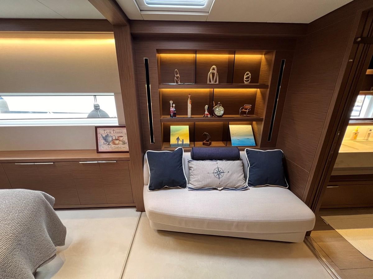 a room with a bed and a shelf aboard 2023 LAGOON 67 Yacht for Sale