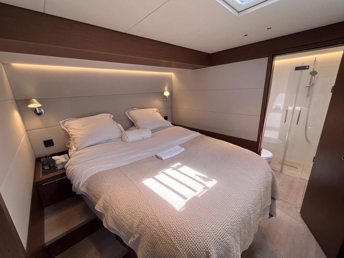 a hotel room with a bed aboard 2023 LAGOON 67 Yacht for Sale