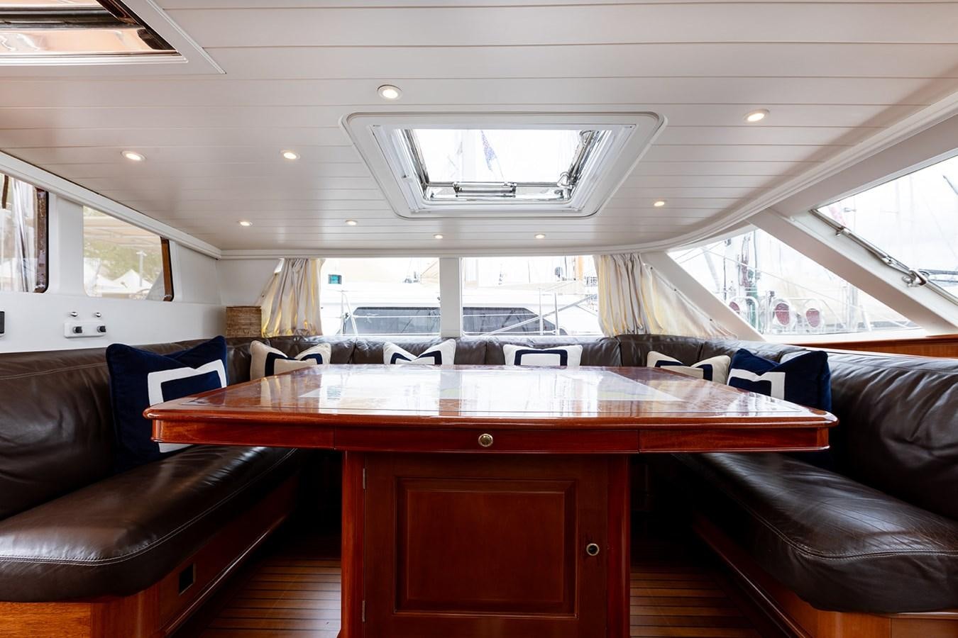 a room with a table and chairs aboard IRELANDA Yacht for Sale