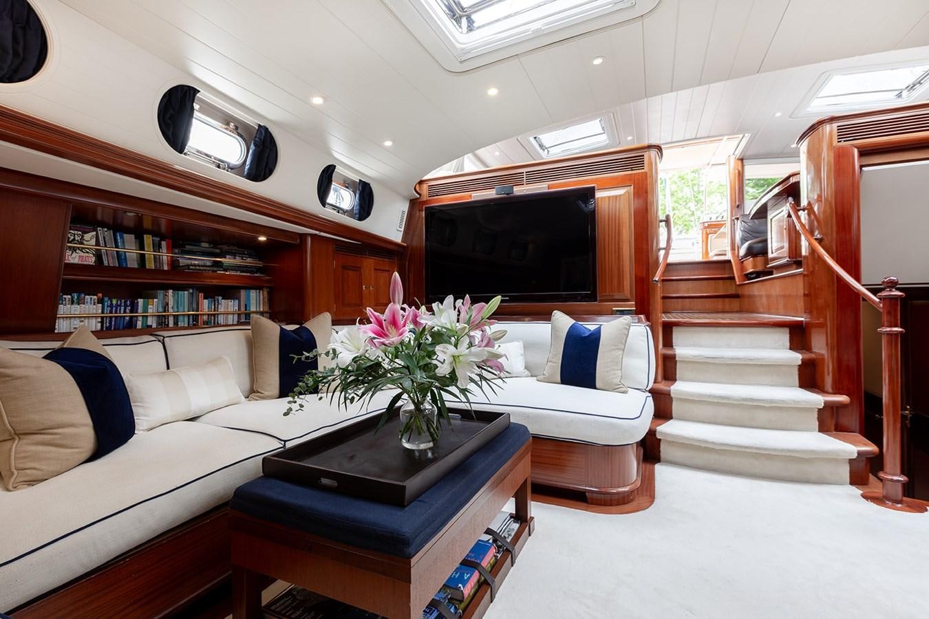a living room with a couch and a television aboard IRELANDA Yacht for Sale
